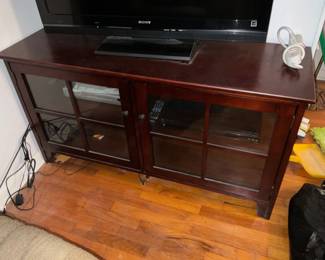 Glass front entertainment console