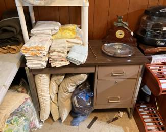 Desk, clocks, bedding, pillows