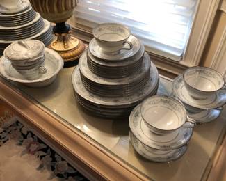 Fine china and daily dinnerware, serving platters, round glass-top table with set of 6 dining chairs, set of matched china cabinets, sideboard, fine glassware, cake stand