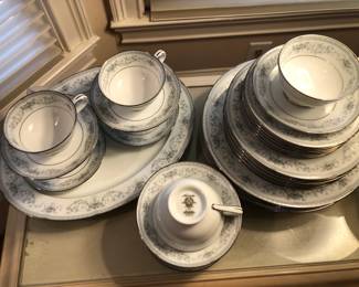 Fine china and daily dinnerware, serving platters, round glass-top table with set of 6 dining chairs, set of matched china cabinets, sideboard, fine glassware, cake stand