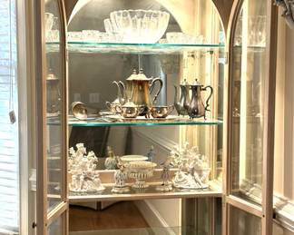 Fine china and daily dinnerware, serving platters, round glass-top table with set of 6 dining chairs, set of matched china cabinets, sideboard, fine glassware, cake stand, silver tea set and pitchers, punch bowl