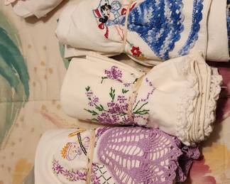 Lots of vintage linens,  ladies handkerchiefs. Aprons, and more