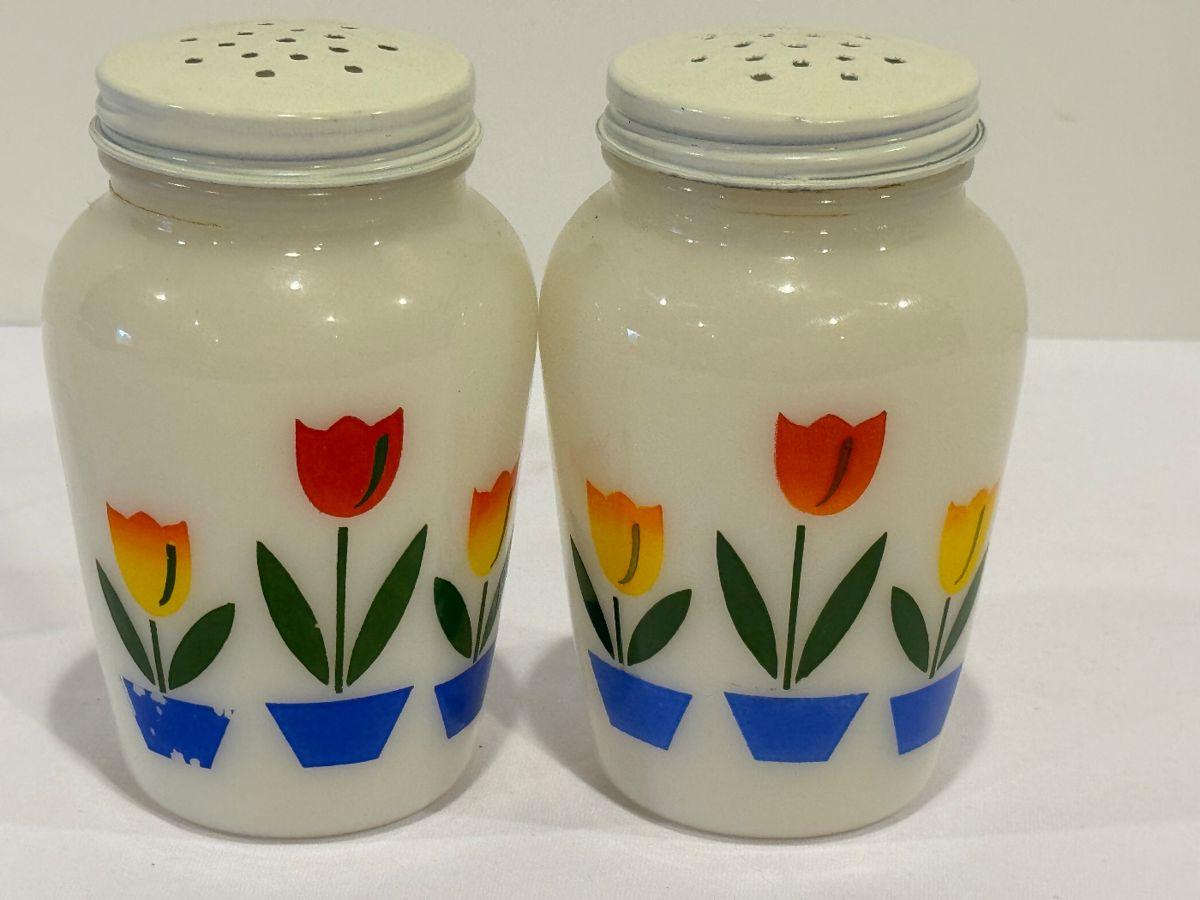 Pair of Vintage Fire King Tulip Milk Glass Salt and Pepper Shakers, measuring about 4.5 inches tall.
