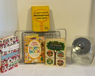 Decorative Metal Basket, Jar, Betty Crocker Outdoor Cookbook and Betty Crocker Party Cookbook. Also includes The Betty Furness Westinghouse Cookbook. The cookbooks are in vintage/used condition with some wear. 