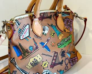 Dooney & Bourke Beige Hollywood Travel USA Satchel measuring about 9.75" x 4" x 8". 

Item in very good condition