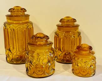 MCM Retro L.E. Smith Amber Moon and Stars Glass Canister Set. Fun! Fun Retro set!

These canisters measure 5.5 inches to 12 inches. The largest one has a small chip in the lid. 