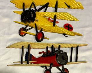 Two Vintage Homco Metal Airplane Wall Plaques. The largest measures 8 x 12 inches. Light wear. Neat decor! 