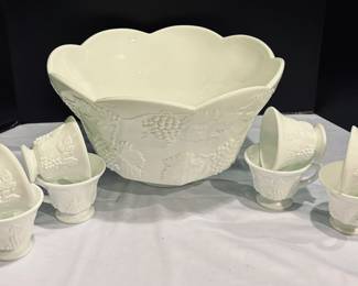 Milk Glass Punch Bowl with 8 Cups. The punch bowl measures 8 inches tall and 13.5 inches. Just add your favorite beverage! 