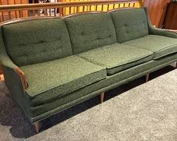 Mid Century Modern Upholstered Sofa by Avant Designs in an awesome retro hue of deep olive green. In overall good condition with light wear and measures 89" x 32" x 28". 