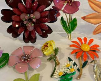 Variety of Floral Brooches in so many fun colors and patterns. Some have slight paint wear. Some are vintage and some are newer. 