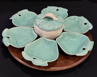 Vintage Mid Century Hoening California Glazed Ceramic Lazy Susan in a sensational vintage hue of blue and features fun apple shaped dishes. The wooden rotating circular tray measures 16 inches wide