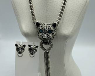 Vintage Betsy Johnson White Tiger Head Necklace and Earrings Set. The necklace features an adjustable length and measures between 16-19 inches long. 