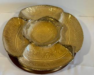 Vintage California Glazed Ceramic Lazy Susan in a shade of tan accented with gold detailing. The wooden rotating tray measures 11 inches.