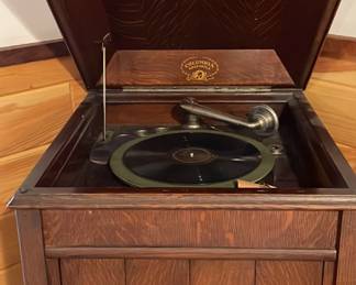 Vintage record player that still winds up.  Along with books of vintage LP's.