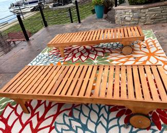 Set of wooden chaise lounge chairs.  We have new cushions as well.  Nice outdoor rugs for sale as well.