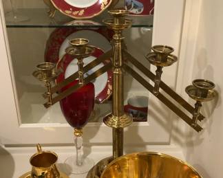 One large matching candle holder; other gold-toned serving pieces