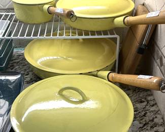 Vintage yellow skillets and pan with lids