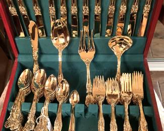 Gold-toned flatware in chest