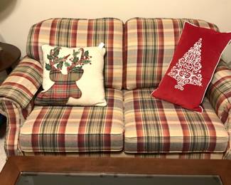 Plaid loveseat; Christmas pillows