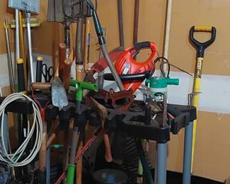 Assorted gardening tools.....rakes, shovels, blower, hand tools, planters, etc