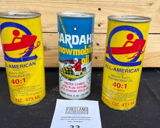 Snowmobile advertising oil cans