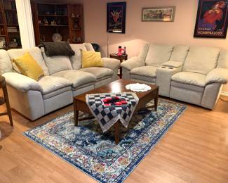 Very comfortable couches, area rug, coffee table