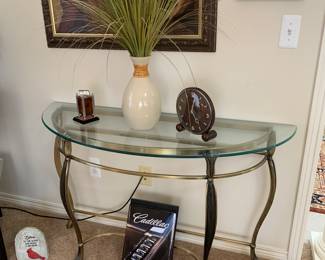 Elegant glass top half moon table, mid century clock, turtle, Cadillac book, antique catalin art deco antique lighter 