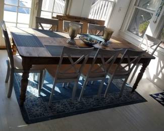 Rustic dining table seats 8. Table made by Ethan Allen. Table is 40" wide and 89" long when the 20" leaf is in place as shown