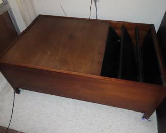 Teak end table with magazine rack.