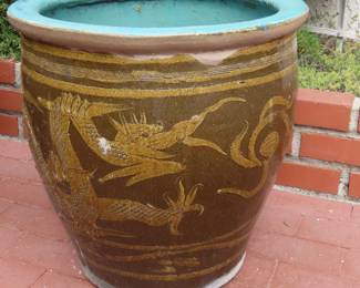 Two large dragon themed planters.