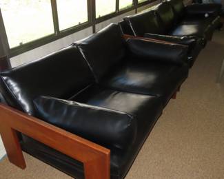 Leatherlike loveseat with wood frame, 1961.