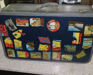 Vintage suitcase with travel decals.