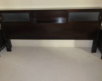 Kalpe headboard with sliding doors.