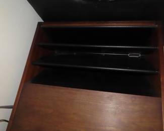 Teak end table with magazine rack.