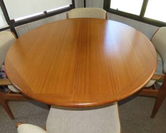 Danish teak dining table/4 chairs and two leaves.