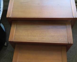 Nesting teak tables.