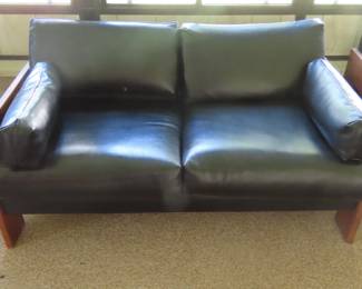 Leatherlike loveseat with wood frame, 1961.