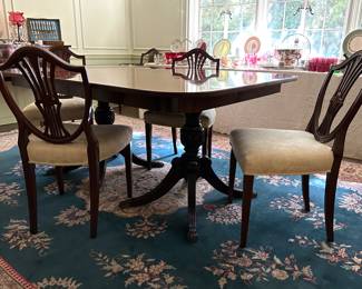 Double pedestal, dining table, satin banded top with three leaves and storage box
