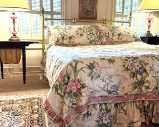 King size brass headboard beside, Victorian, sewing table and antique glass door able lamp, custom bed linens