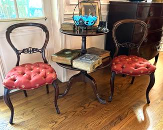 Balloon-back parlor chairs, two-tiered pedestal table, antique photo albums, glass and quadruple plate bride basket