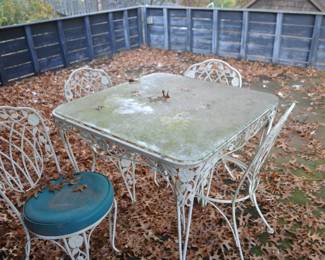 Wrought iron patio table with 4 chairs 