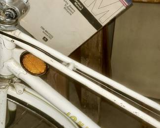 Close up of John Deere bike w/ paperwork