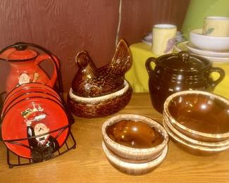 Modern coffee pot and plates, stoneware hen on nest, bean pot and bowls