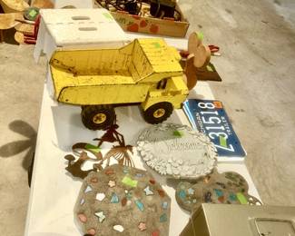 Tonka toy truck, cement garden stepping stones, etc.