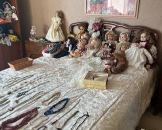 assortment of jewelry and dolls