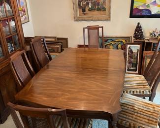 solid wood dining table with leaf. Mid-century modern. includes 6 chairs with velvety fabric. good condition