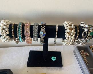 assortment of costume jewelry, necklaces, bracelets and earrings