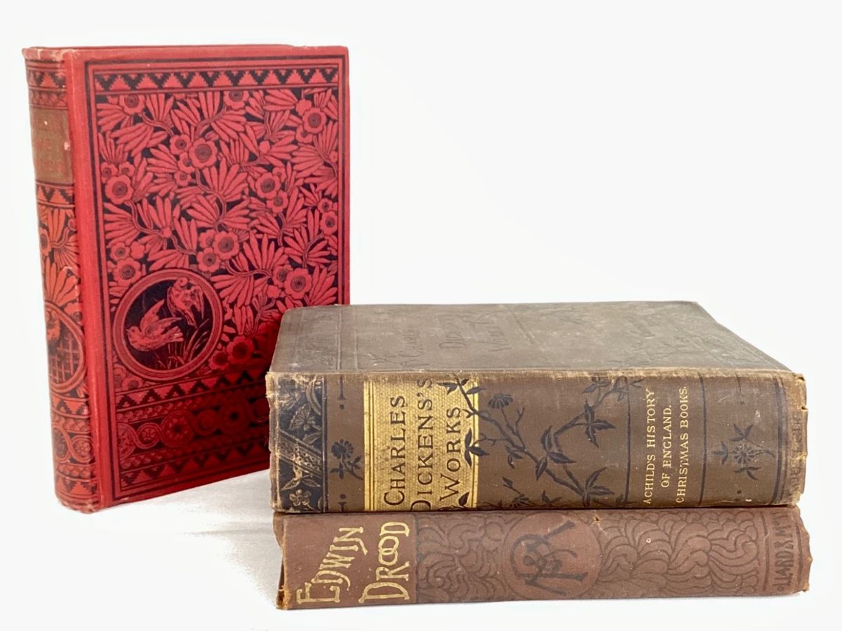 JUCR946 Antique Charles Dickens Books Dame Duren red hardcover book, 1897. &nbsp;A Child's History of England. &nbsp;Christmas Books, hardcover. &nbsp;Edwin Drood hardcover, 1889. &nbsp;Some wear due to age such as binding separation, discoloration, tears.
