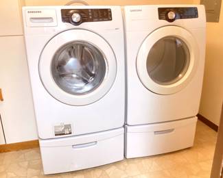 JETH952 Samsung Front Loading Washer Dryer White Samsung front loading washing machine with 1 drawer pedastal - model WF210ANWXAA. White Samsung front loading Dryer with 1 drawer pedastal - model # DV21AEWXAA. Energy star. 120volt. Both machines work - see videos. Hoses and power cords included.