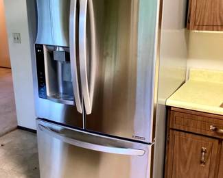 JETH954 LG French Door Fridge LG Stainless steel 27 cubic ft French door fridge with bottom freezer. Slim space plus ice maker & water dispenser. Works - photos. Includes 1 new in box LG water filter.